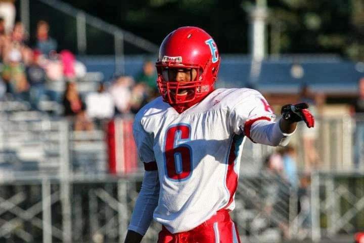 Young Derrick playing football
